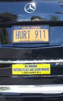 image showing Motorcycle awareness bumper sticker on Phil's car