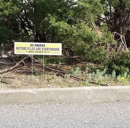 motorcycle awareness lawn sign at Walmart exit